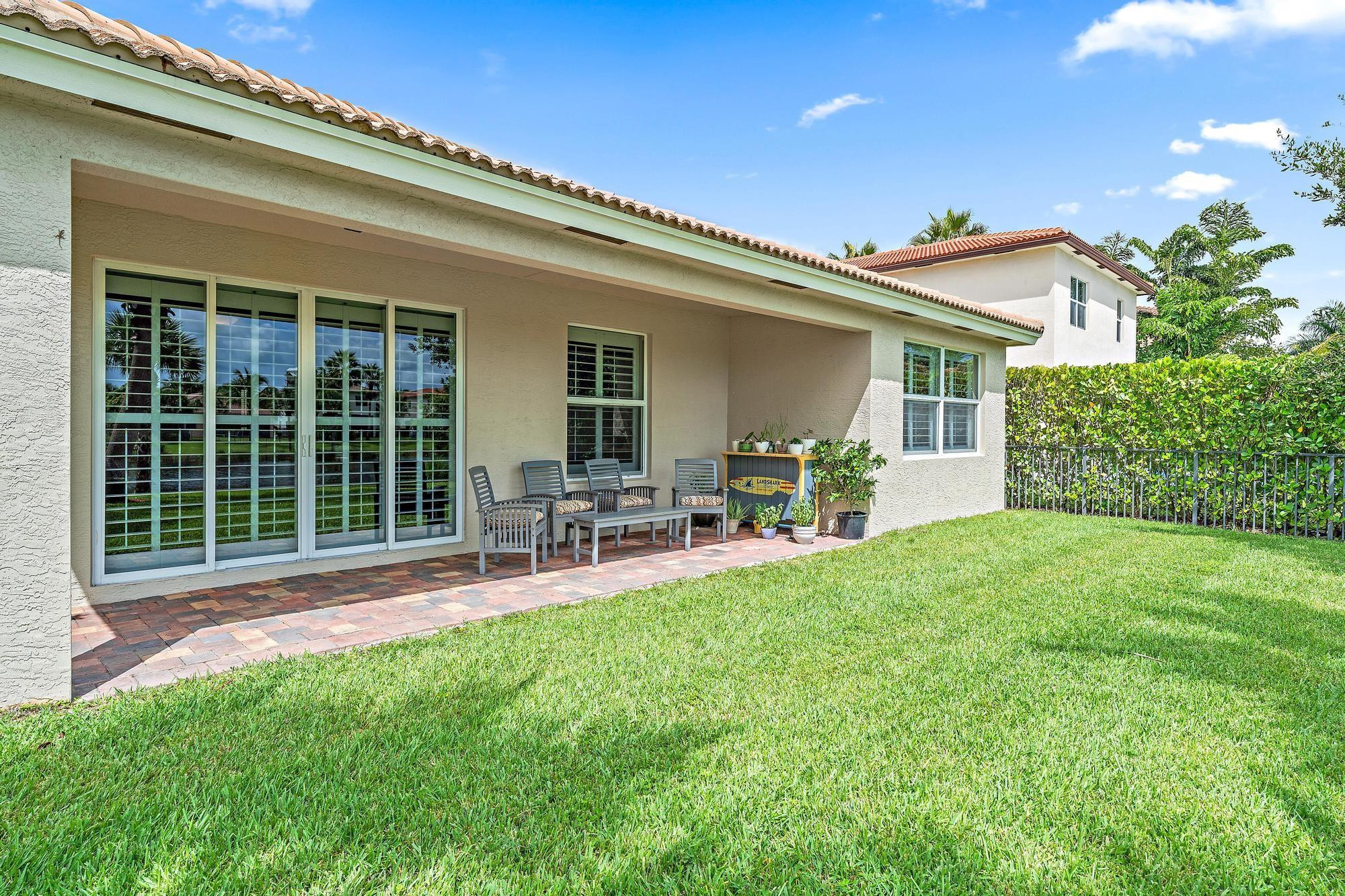 198 Umbrella Place Jupiter, FL 33458 - Photo 27 of 39 a house view with a sitting space and garden space
