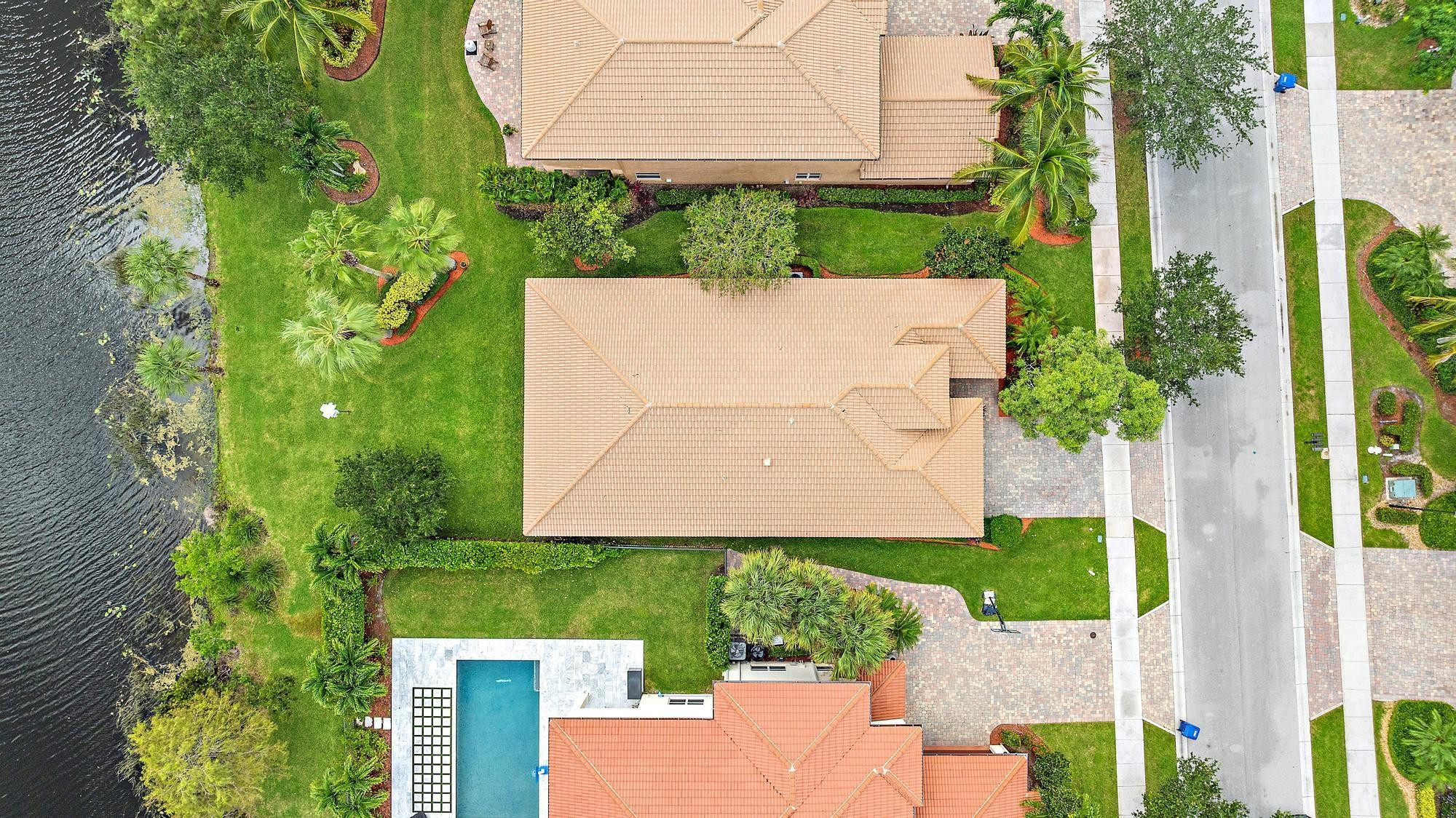 198 Umbrella Place Jupiter, FL 33458 - Photo 32 of 39 an aerial view of a house with a garden and trees
