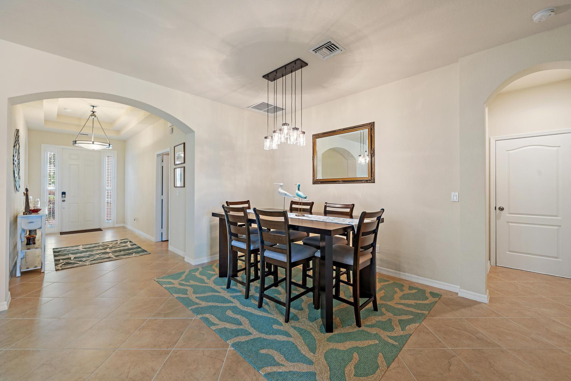 198 Umbrella Place Jupiter, FL 33458 - Photo 4 of 39 a view of a dining room with furniture