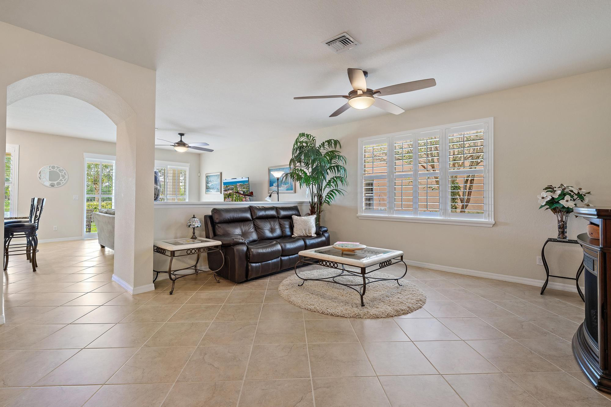 198 Umbrella Place Jupiter, FL 33458 - Photo 7 of 39 a living room with furniture and a window
