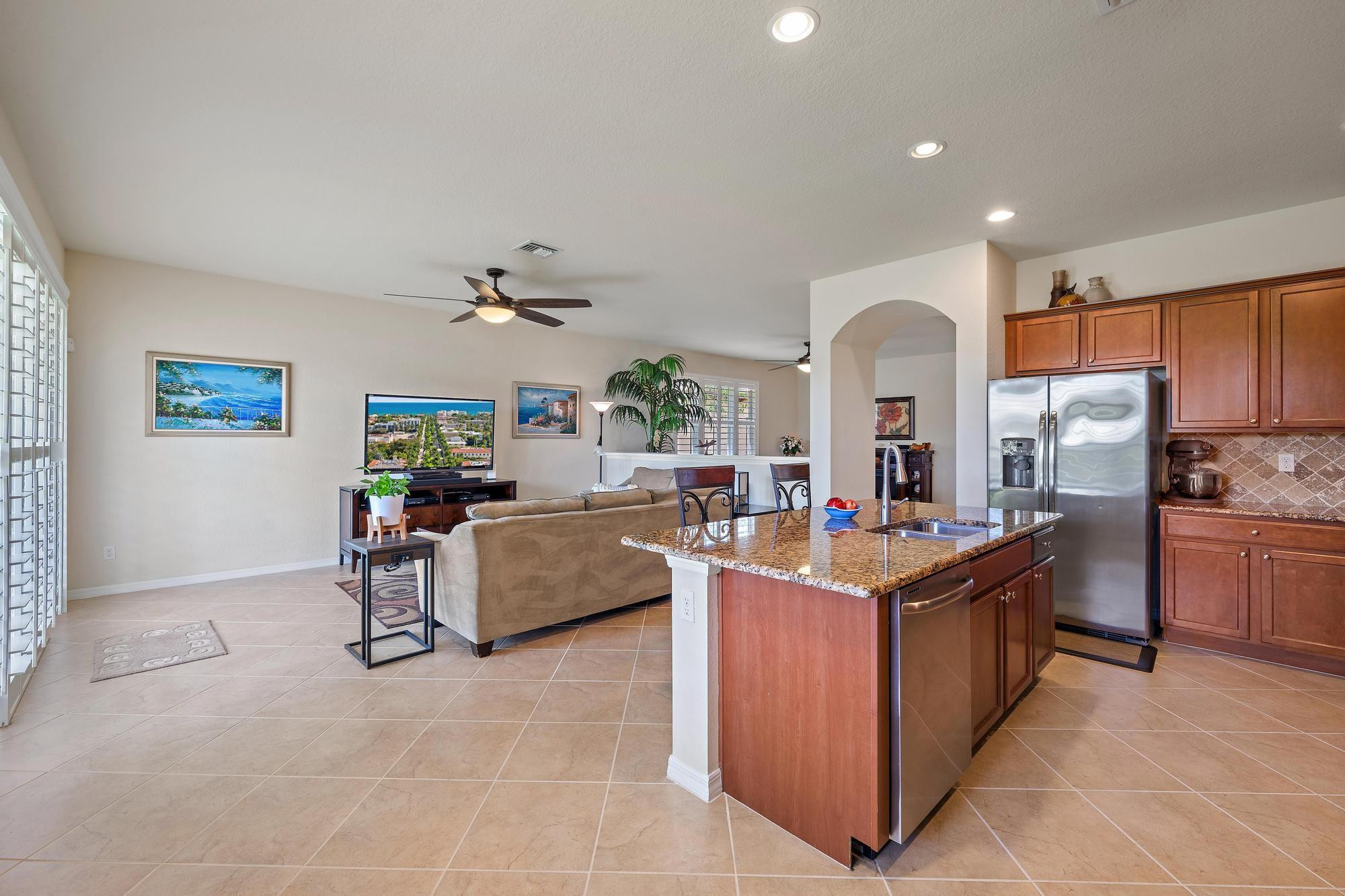 198 Umbrella Place Jupiter, FL 33458 - Photo 10 of 39 a kitchen that has a lot of cabinets and refrigerator in it
