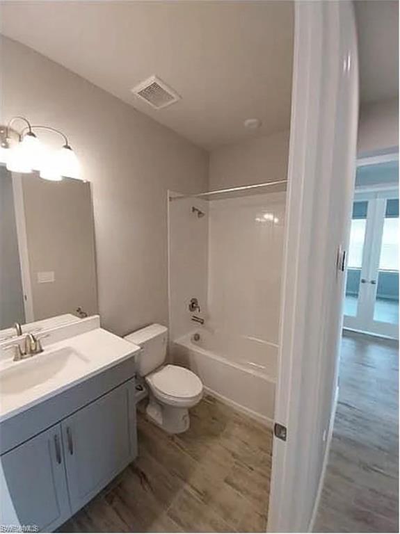 4551 Arboretum Circle, Unit 203 Naples, FL 34112 - Photo 25 of 41 a bathroom with a sink a toilet a mirror and shower