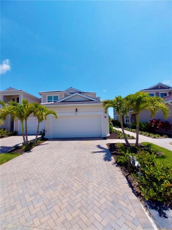 4551 Arboretum Circle, Unit 203 Naples, FL 34112 - Photo 33 of 41 a pathway of a house with a yard