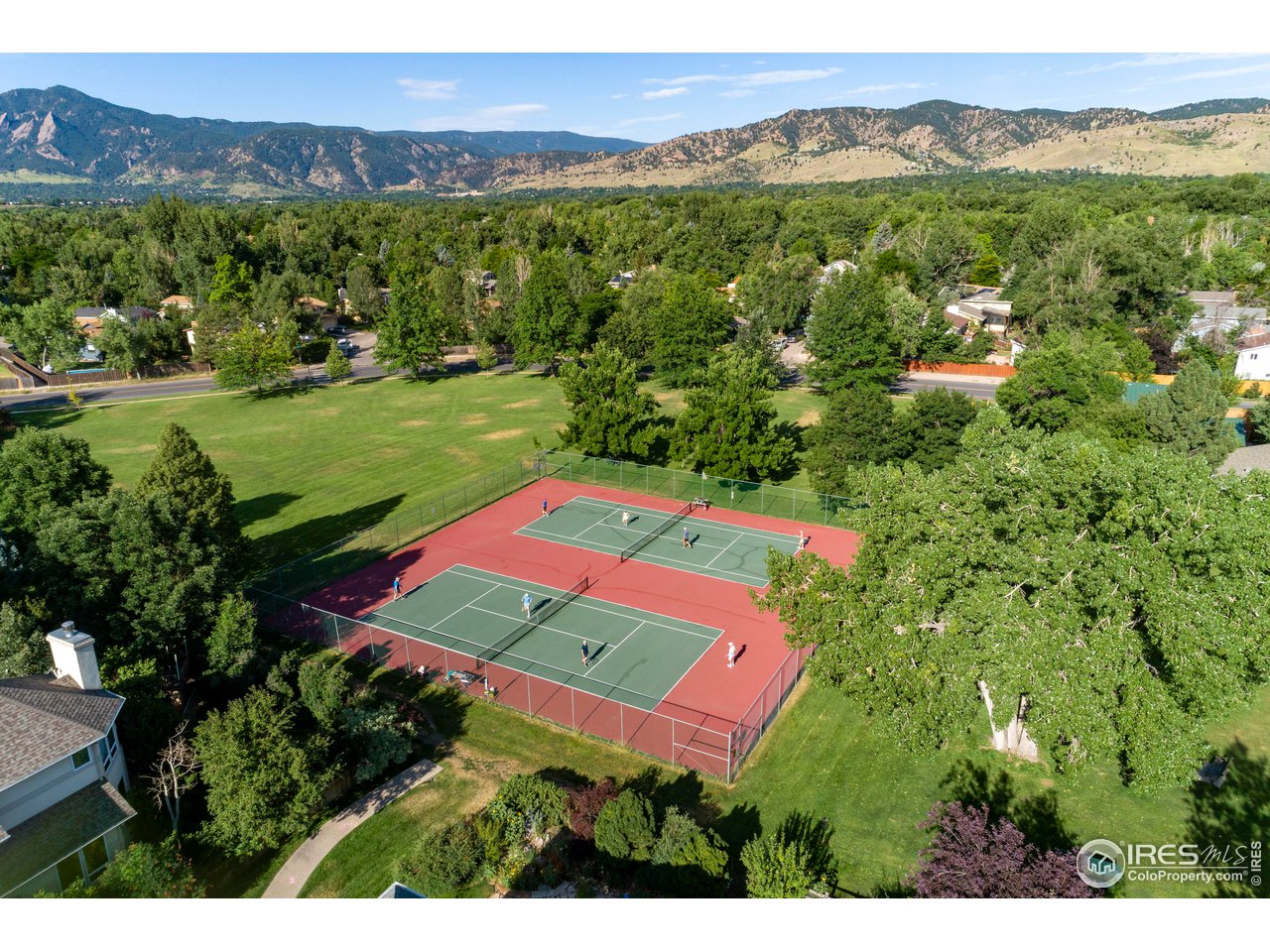 4141 South Hampton Circle Boulder, CO 80301 - Photo 37 of 39 a view of a lush green hillside and a houses