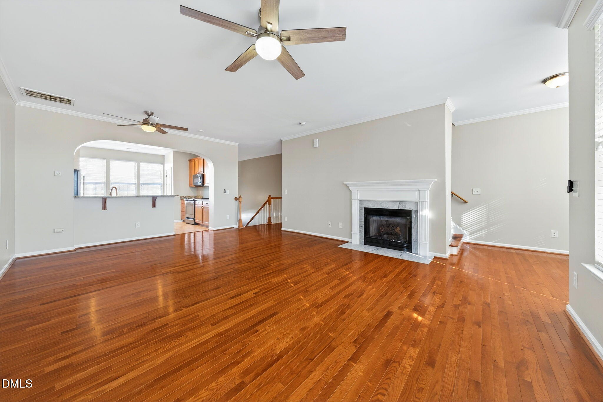 4523 Pale Moss Drive Raleigh, NC 27606 - Photo 11 of 42 a view of empty room with wooden floor and fan