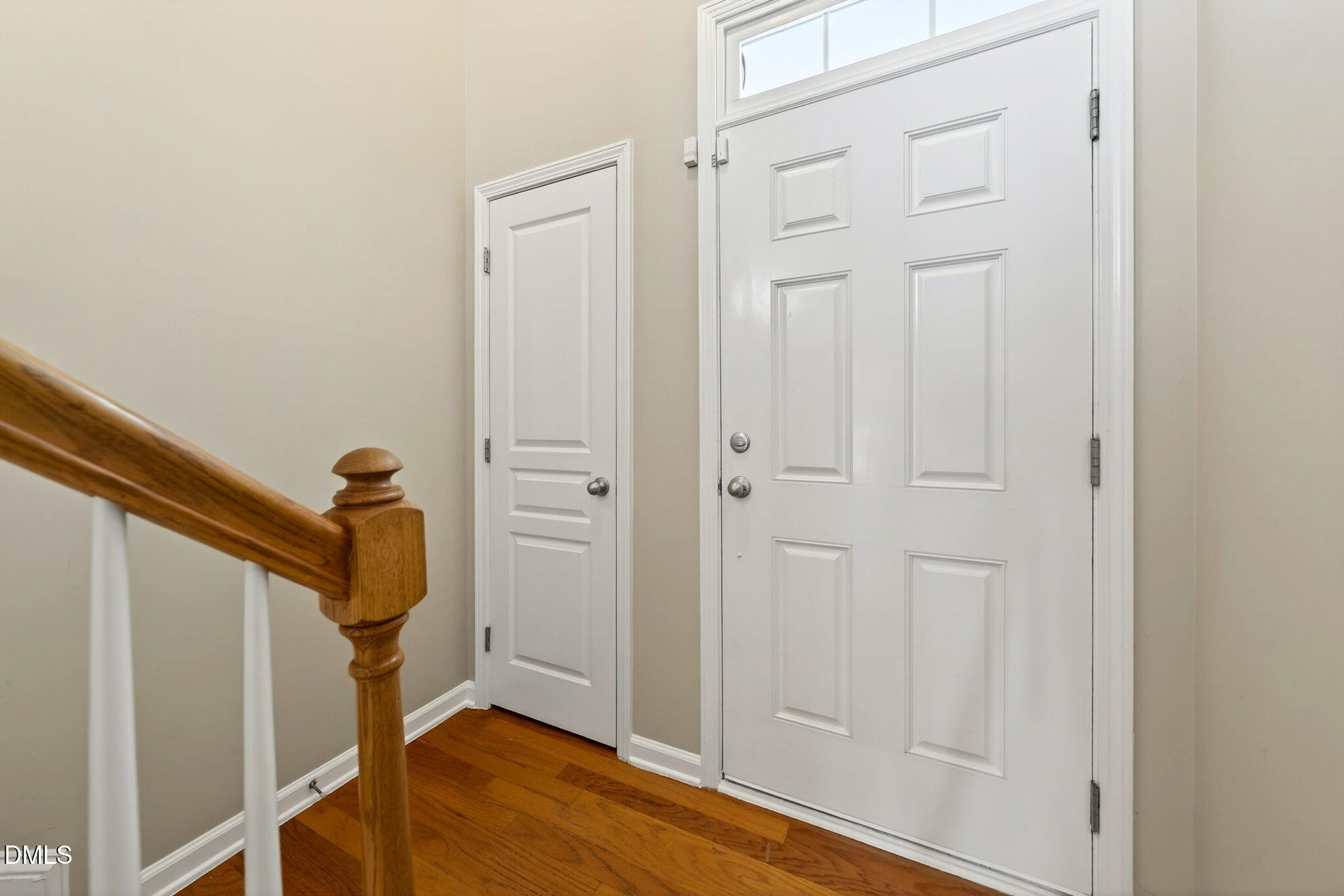 4523 Pale Moss Drive Raleigh, NC 27606 - Photo 14 of 42 a view of a hallway with wooden floor and staircase