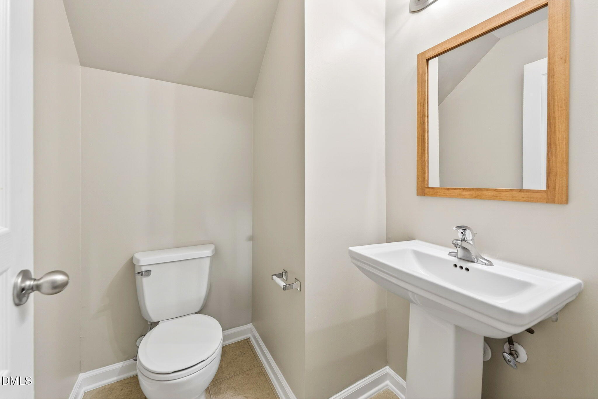 4523 Pale Moss Drive Raleigh, NC 27606 - Photo 22 of 42 a bathroom with a toilet a sink and mirror