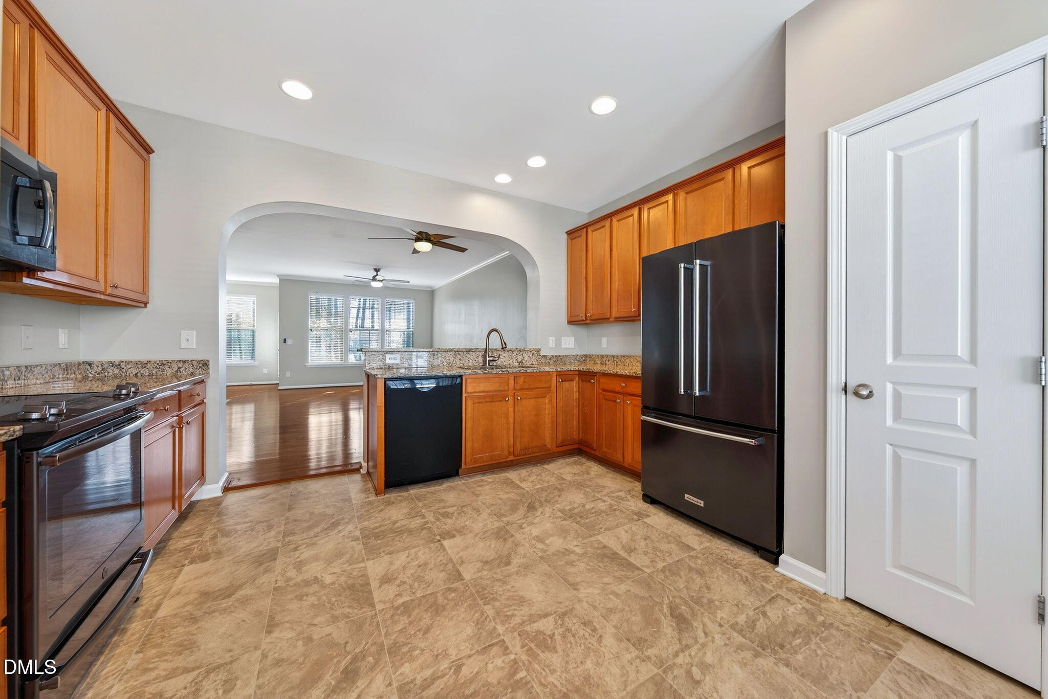 4523 Pale Moss Drive Raleigh, NC 27606 - Photo 24 of 42 a kitchen with stainless steel appliances granite countertop a refrigerator and a stove top oven