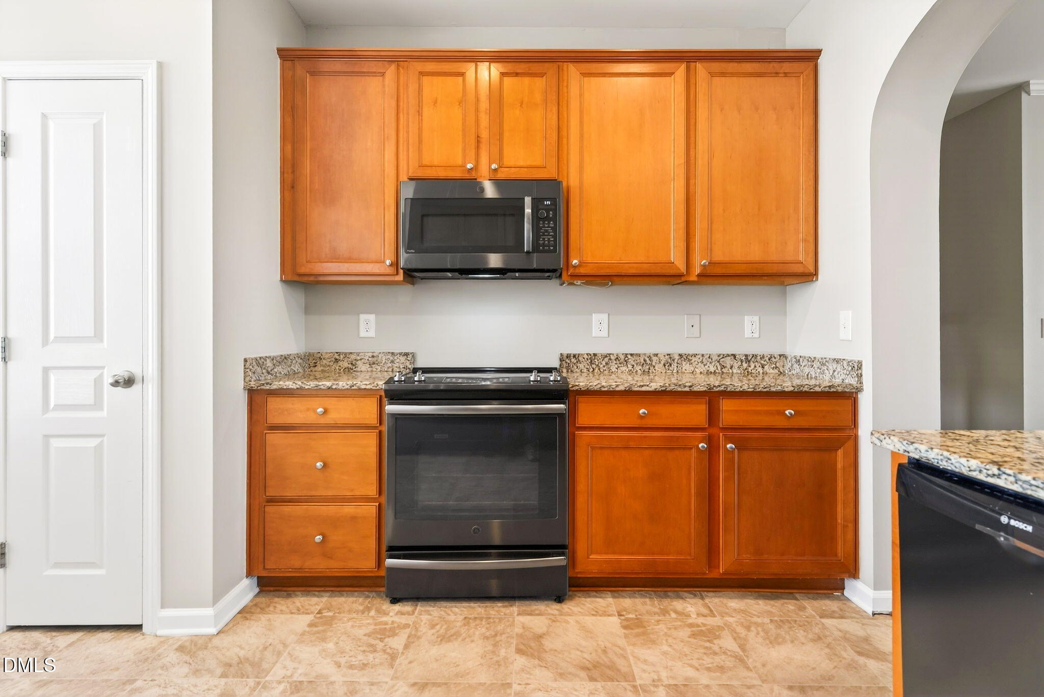 4523 Pale Moss Drive Raleigh, NC 27606 - Photo 25 of 42 a kitchen with stainless steel appliances granite countertop a refrigerator and a stove top oven