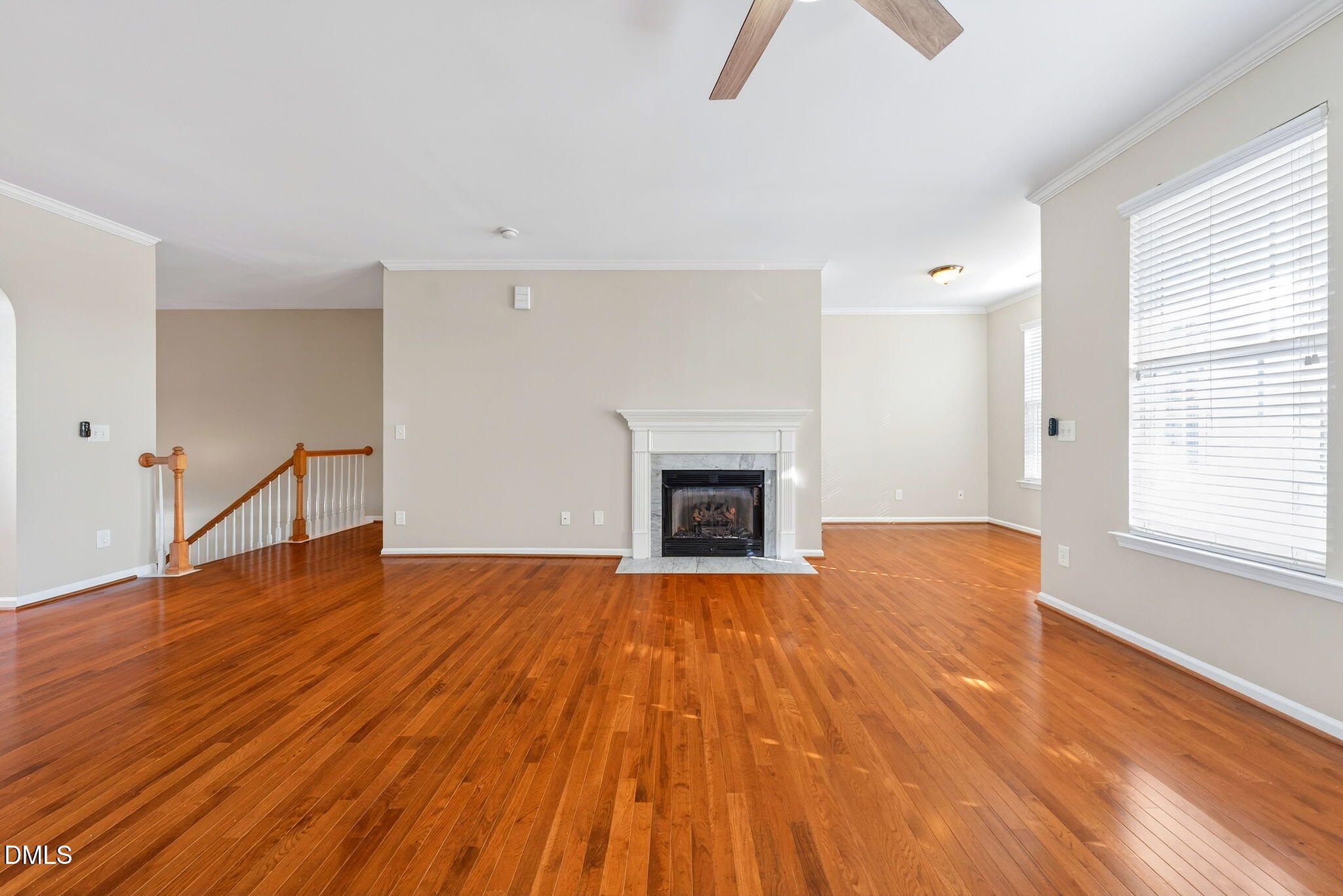 4523 Pale Moss Drive Raleigh, NC 27606 - Photo 26 of 42 a view of empty room with wooden floor and fireplace