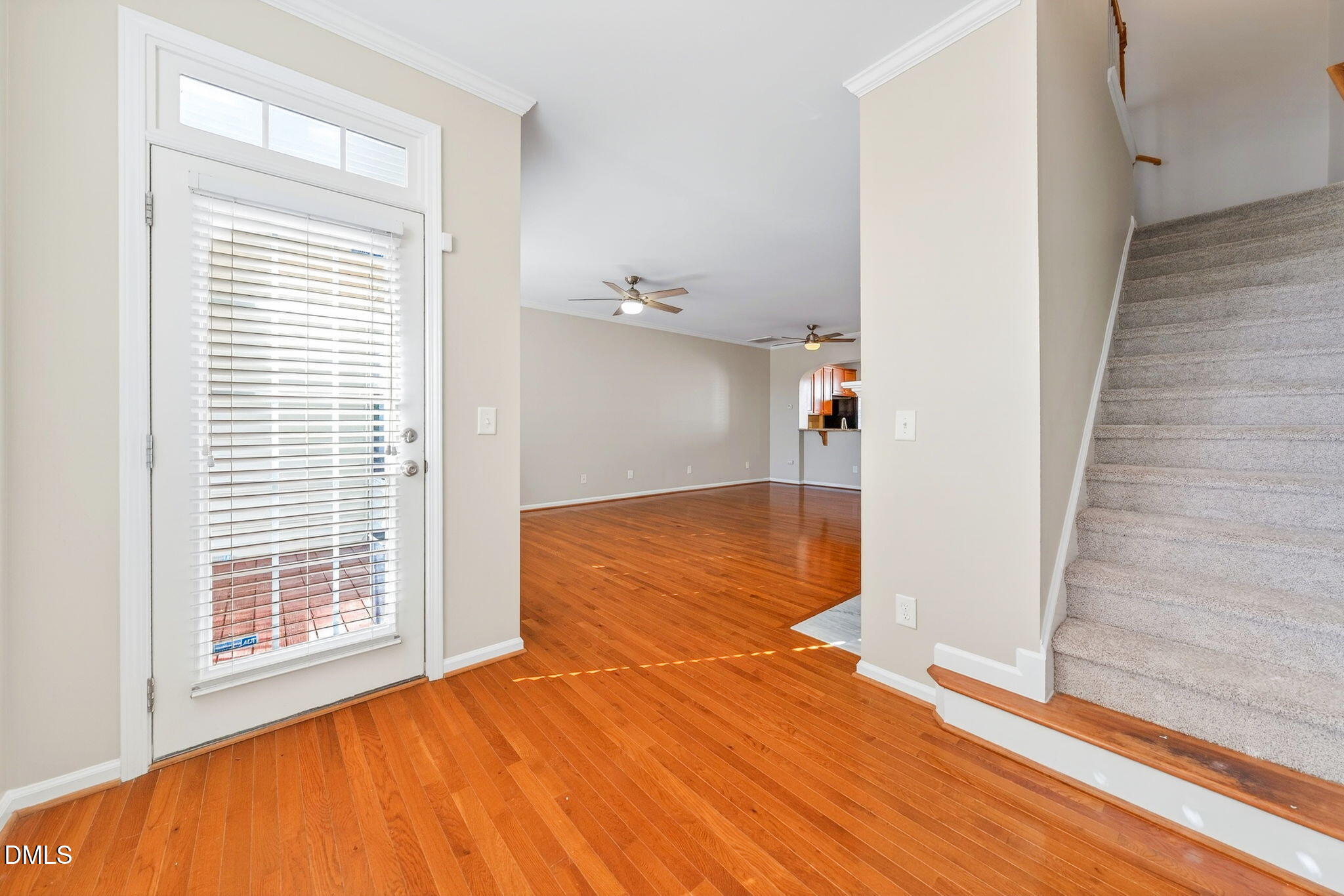 4523 Pale Moss Drive Raleigh, NC 27606 - Photo 28 of 42 a view of an empty room with wooden floor and a window