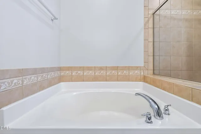 a bath tub sitting next to a window