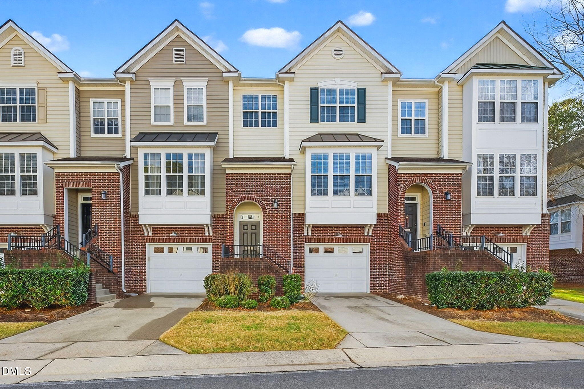 4523 Pale Moss Drive Raleigh, NC 27606 - Photo 39 of 42 a front view of a house with a yard and garage