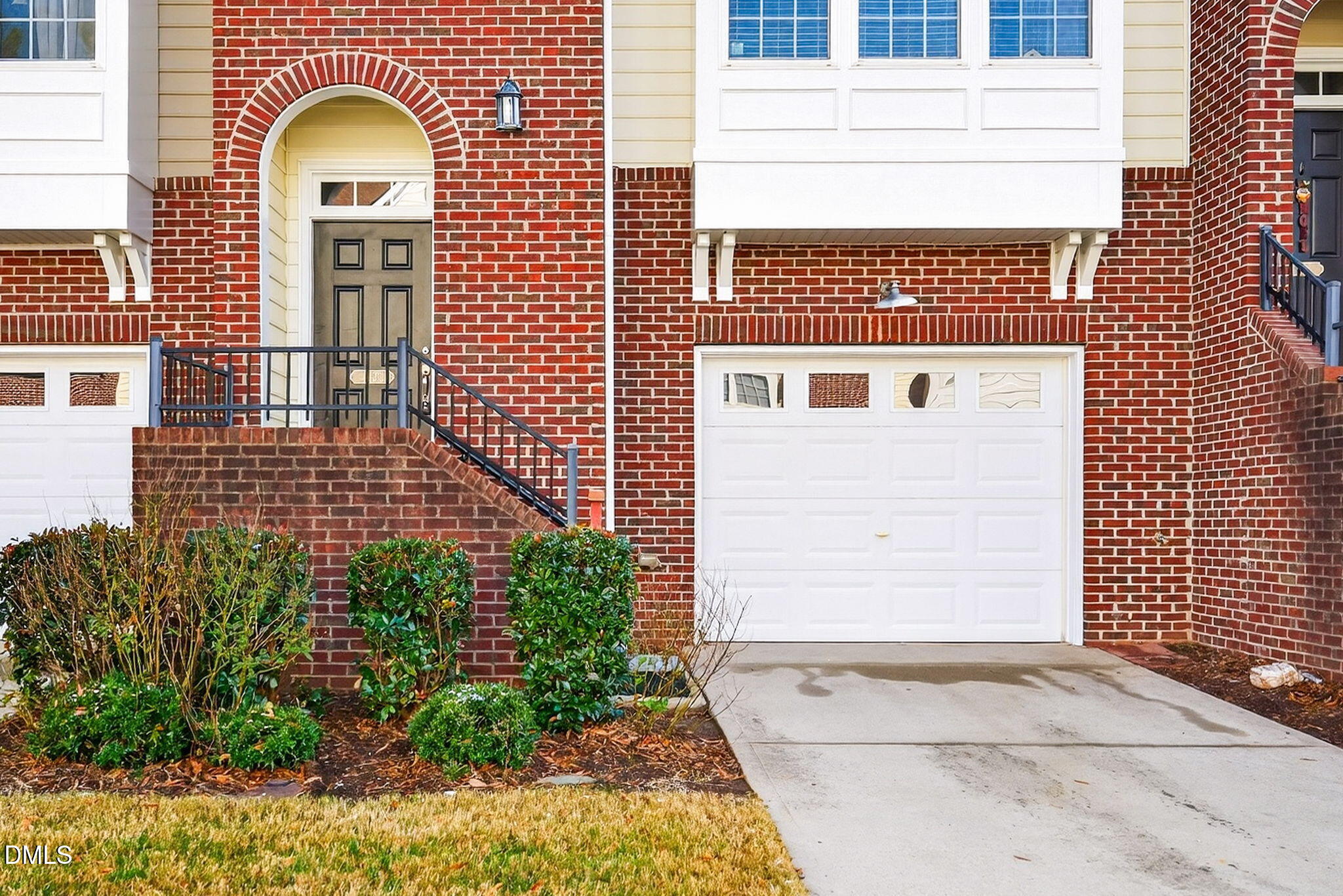 4523 Pale Moss Drive Raleigh, NC 27606 - Photo 40 of 42 a view of a brick house with potted plants
