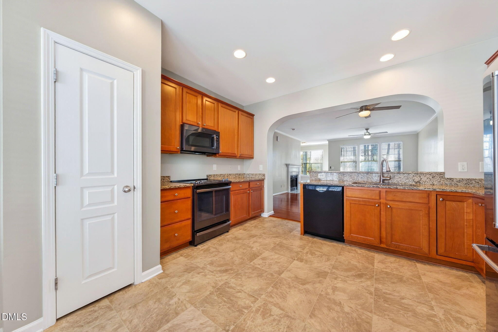 4523 Pale Moss Drive Raleigh, NC 27606 - Photo 4 of 42 a large kitchen with stainless steel appliances granite countertop a large counter top cabinets and a sink
