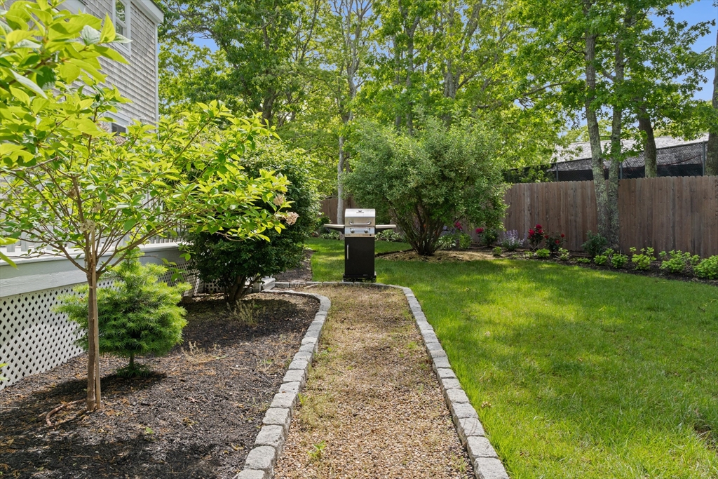 4 Hye Lane Edgartown, MA 02539 - Photo 39 of 41 a view of a yard with plants and large trees