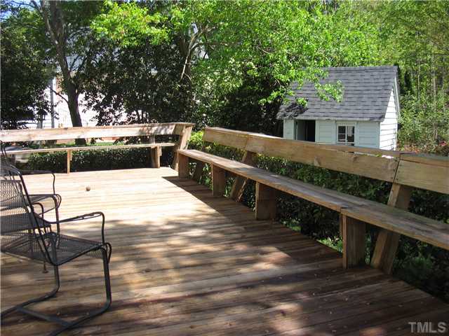 613 Lake Boone Trail Raleigh, NC 27608 - Photo 18 of 18 a view of a patio with chairs and wooden fence