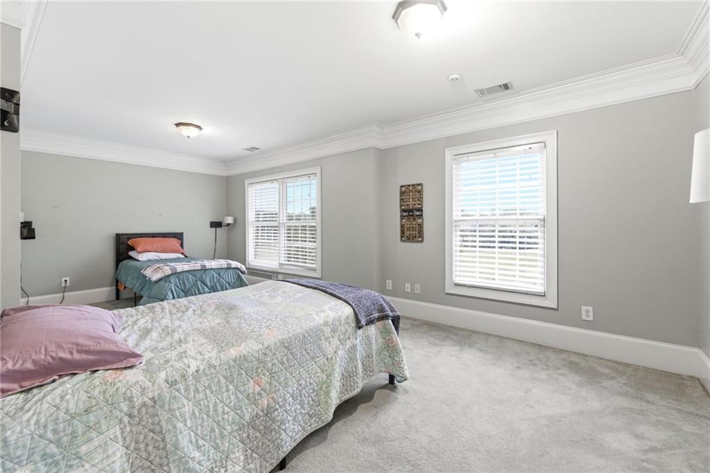 4337 Mountain View Road Oakwood, GA 30566 - Photo 42 of 84 a bedroom with a bed and a window