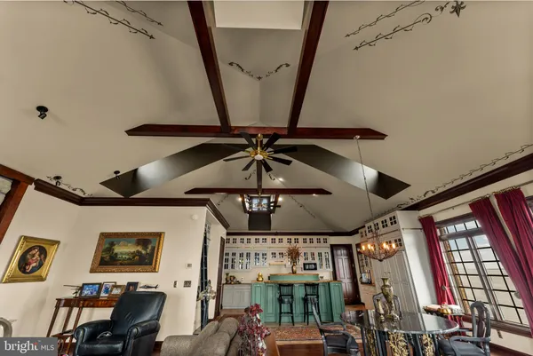 a living room with furniture fireplace and flat screen tv