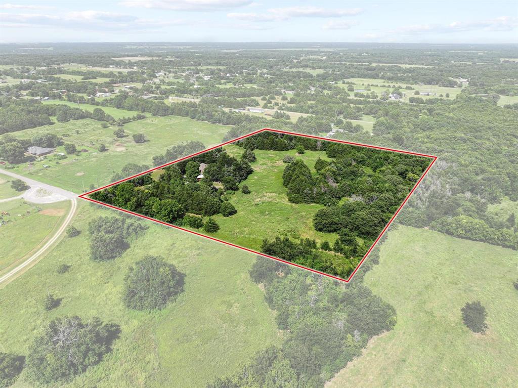252 Meadow Lake Estates Road Denison, TX 75021 - Photo 32 of 37 Expansive land parcel featuring a mix of open grassy areas and mature tree coverage
