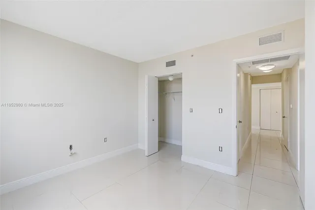 a building outdoor space with patio furniture and garden