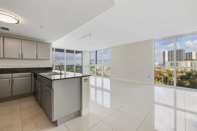 a kitchen with stainless steel appliances granite countertop a stove and a sink