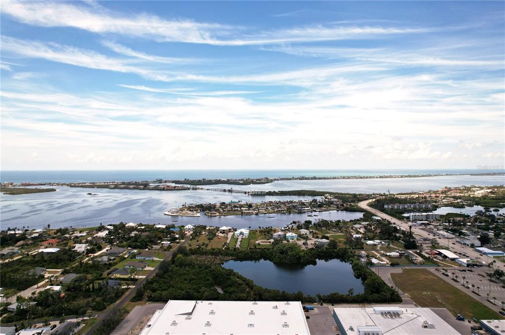 an aerial view of residential building and ocean