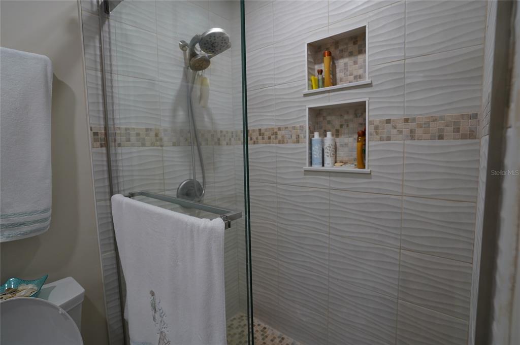 1531 Placida Road, Unit 204 Englewood, FL 34223 - Photo 18 of 52 a bathroom with a shower