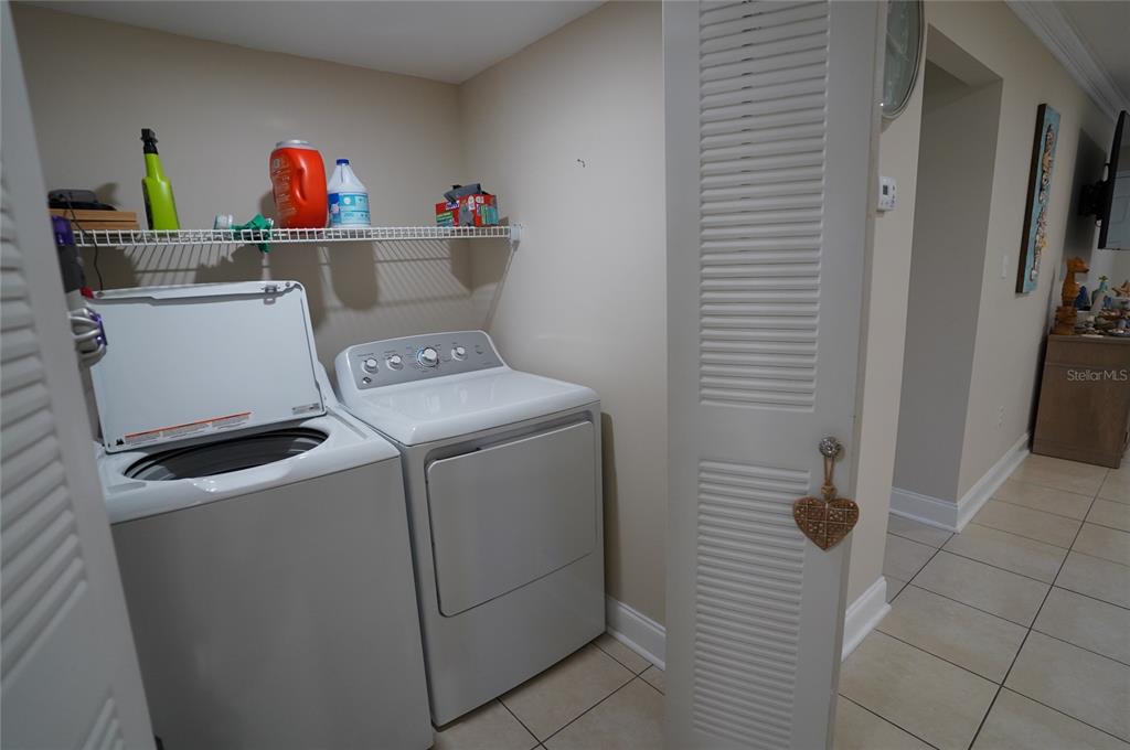 1531 Placida Road, Unit 204 Englewood, FL 34223 - Photo 24 of 52 a utility room with dryer and washer