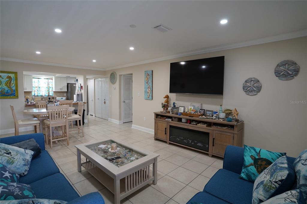 1531 Placida Road, Unit 204 Englewood, FL 34223 - Photo 6 of 52 a living room with furniture and a flat screen tv