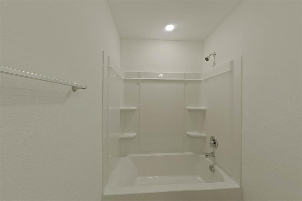 1601 Parlier Street McKinney, TX 75071 - Photo 19 of 29 a bathroom with a bathtub