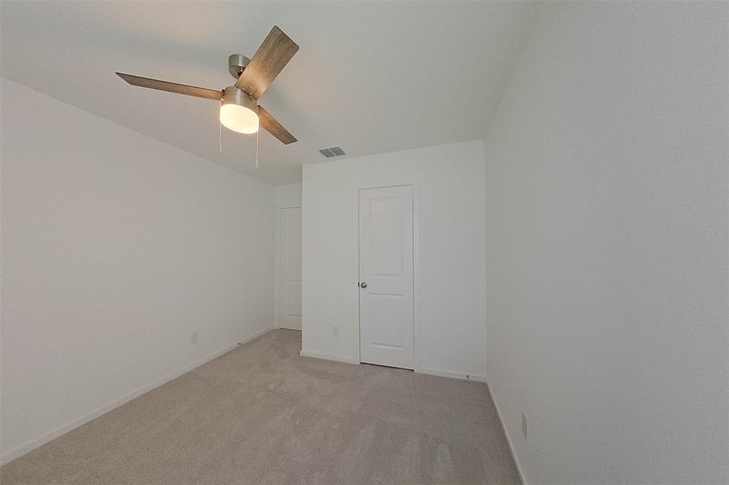 1601 Parlier Street McKinney, TX 75071 - Photo 20 of 29 a view of an empty room and a ceiling fan