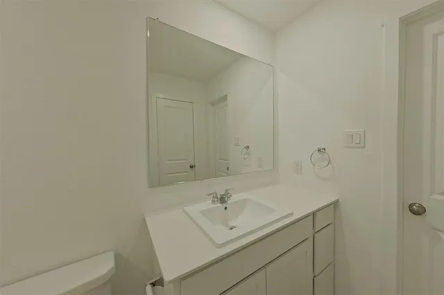 a bathroom with a sink and a toilet