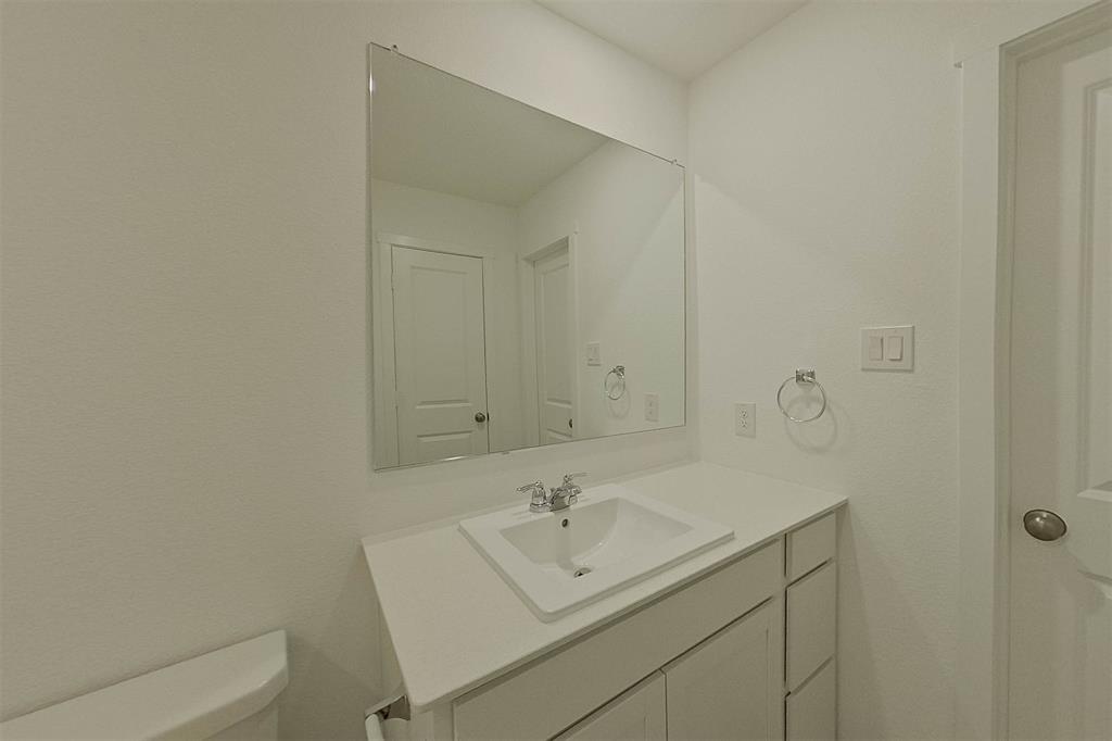 1601 Parlier Street McKinney, TX 75071 - Photo 24 of 29 a bathroom with a sink and a toilet