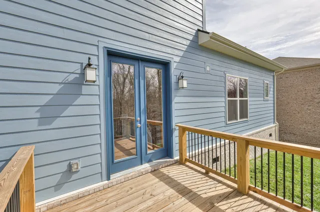 a view of a balcony with wooden floor