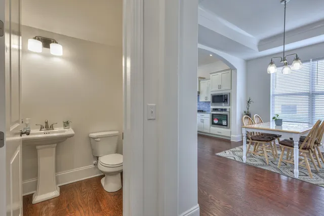 a bathroom with a toilet a sink and a mirror
