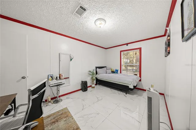 a room with furniture and a wooden floor