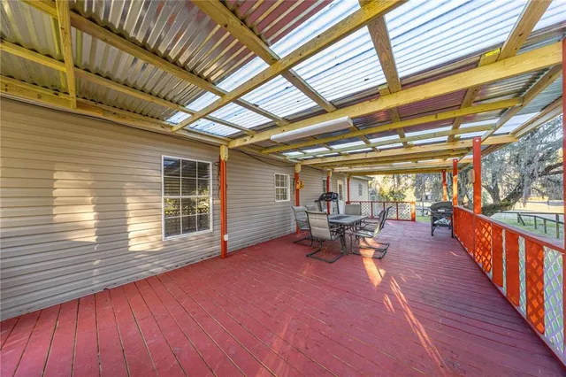 a view of a porch with wooden floor
