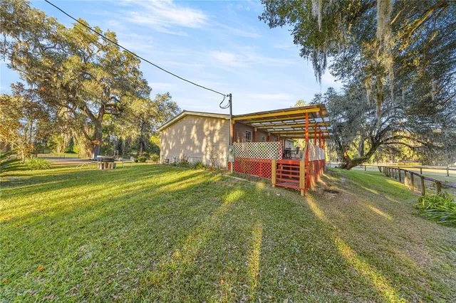 a view of backyard with green space