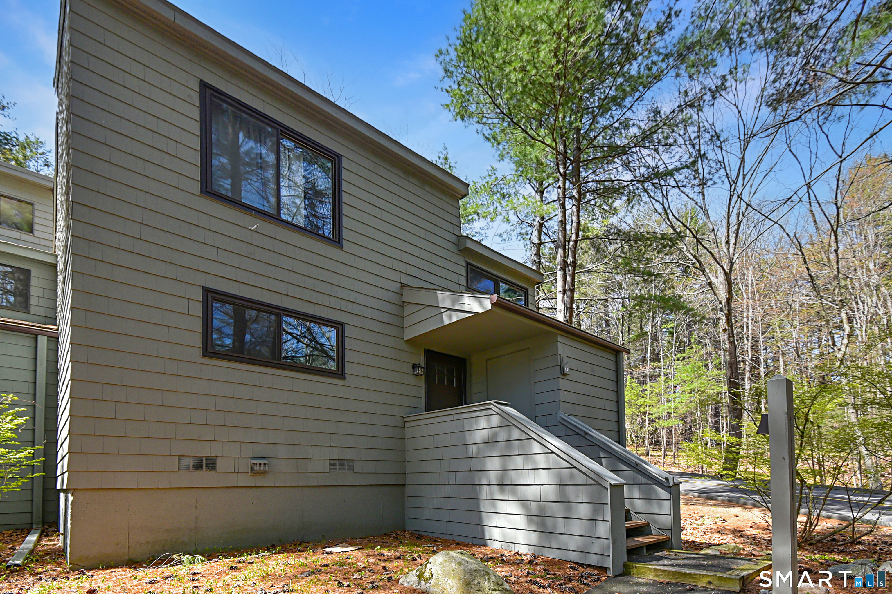 151 Old Farms, Unit 151 Torrington, CT 06790 - Photo 1 of 39 a view of a house with a yard