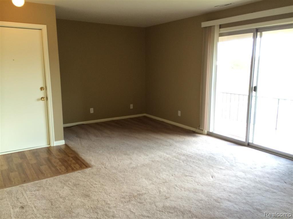 409 West Highland Road, Unit B10 Howell, MI 48843 - Photo 13 of 17 Living room