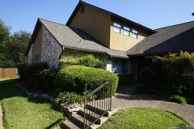 a backyard of a house with lots of green space
