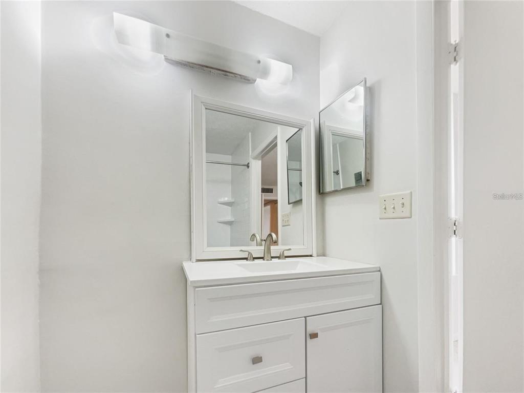 524 Orange Drive, Unit 22 Altamonte Springs, FL 32701 - Photo 11 of 18 a bathroom with a sink and a mirror