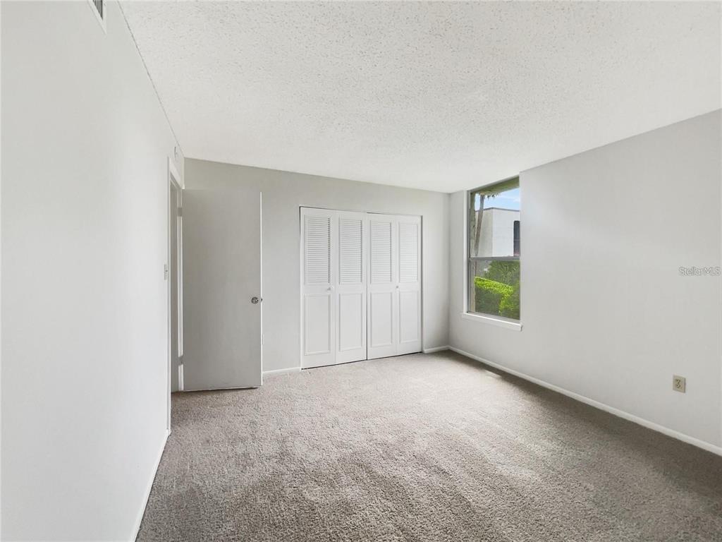 524 Orange Drive, Unit 22 Altamonte Springs, FL 32701 - Photo 12 of 18 a view of an empty room with a window