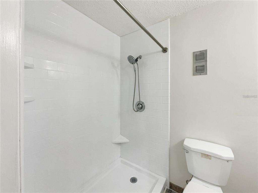 524 Orange Drive, Unit 22 Altamonte Springs, FL 32701 - Photo 14 of 18 a bathroom with a toilet and shower
