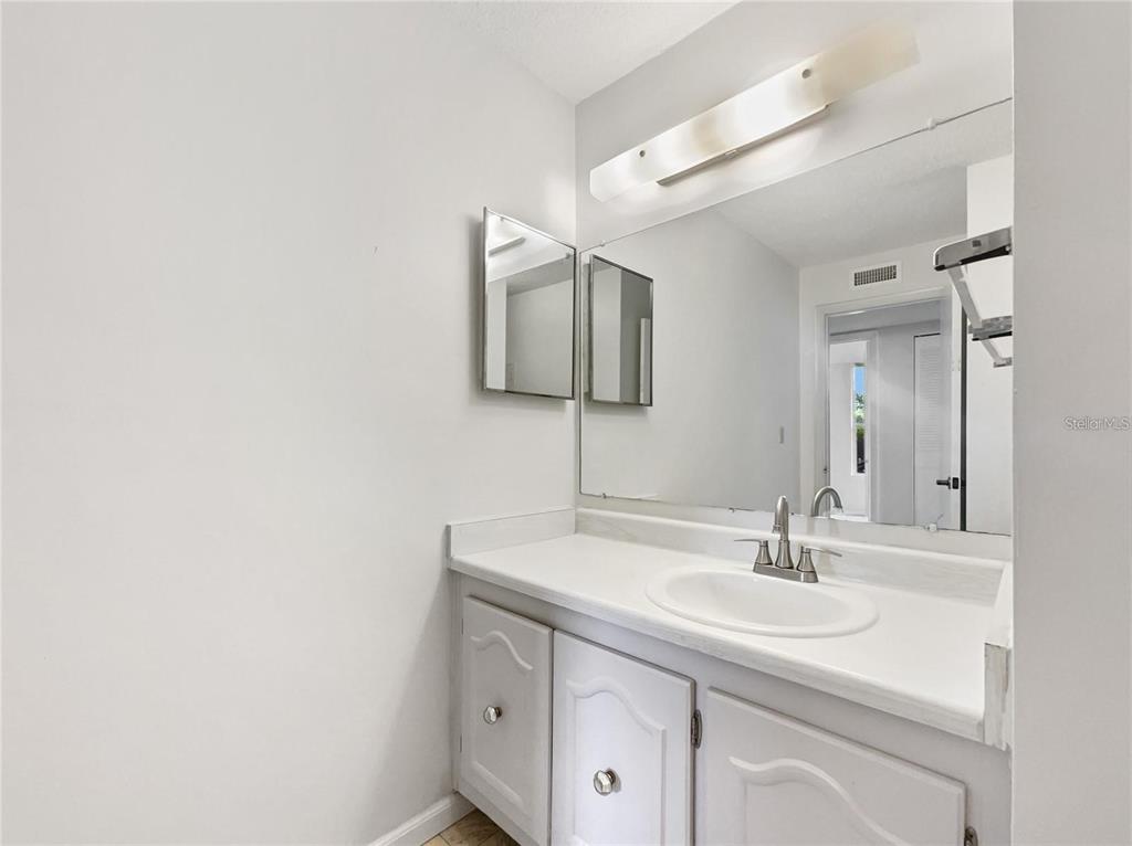 524 Orange Drive, Unit 22 Altamonte Springs, FL 32701 - Photo 15 of 18 a bathroom with a sink and a mirror