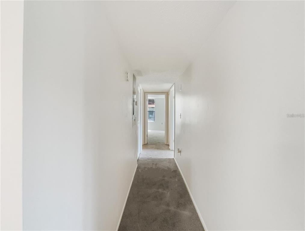 524 Orange Drive, Unit 22 Altamonte Springs, FL 32701 - Photo 17 of 18 a view of a hallway with wooden floor