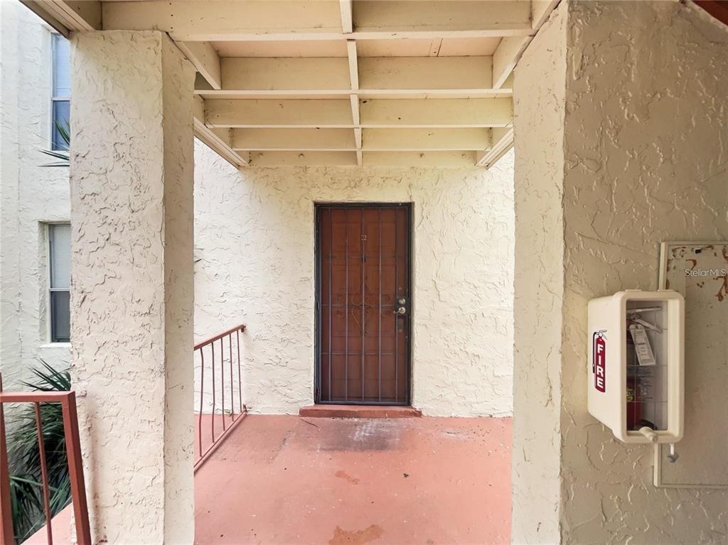 524 Orange Drive, Unit 22 Altamonte Springs, FL 32701 - Photo 4 of 18 a view of a hallway with wooden walls