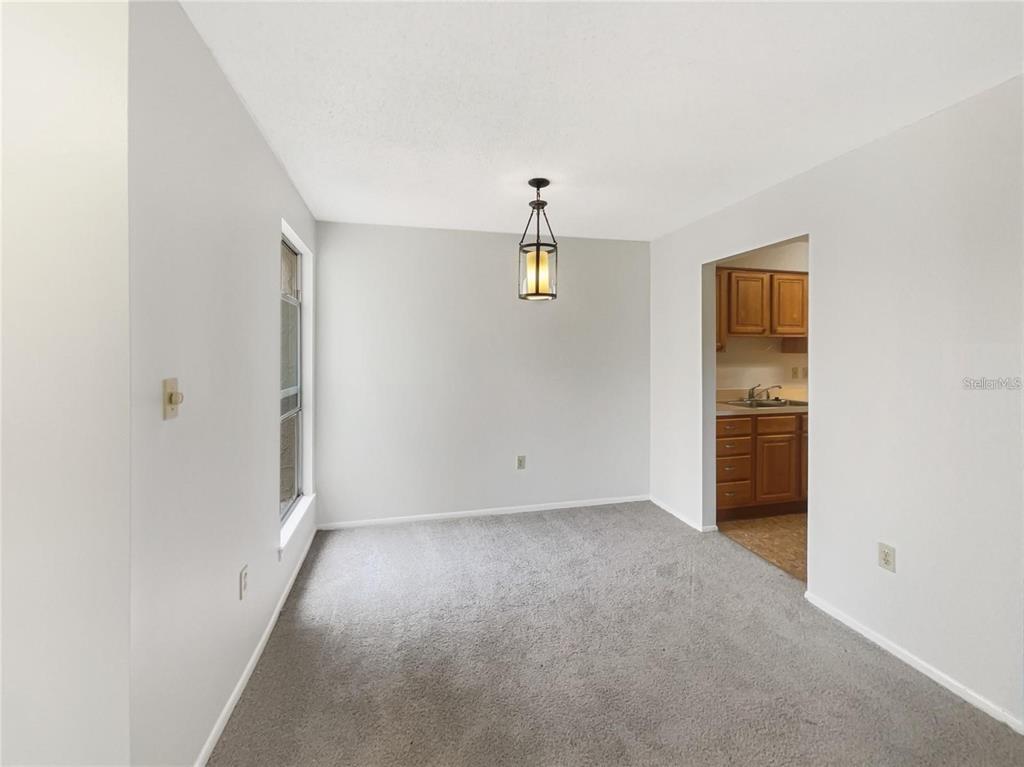 524 Orange Drive, Unit 22 Altamonte Springs, FL 32701 - Photo 8 of 18 an empty room with windows and closet