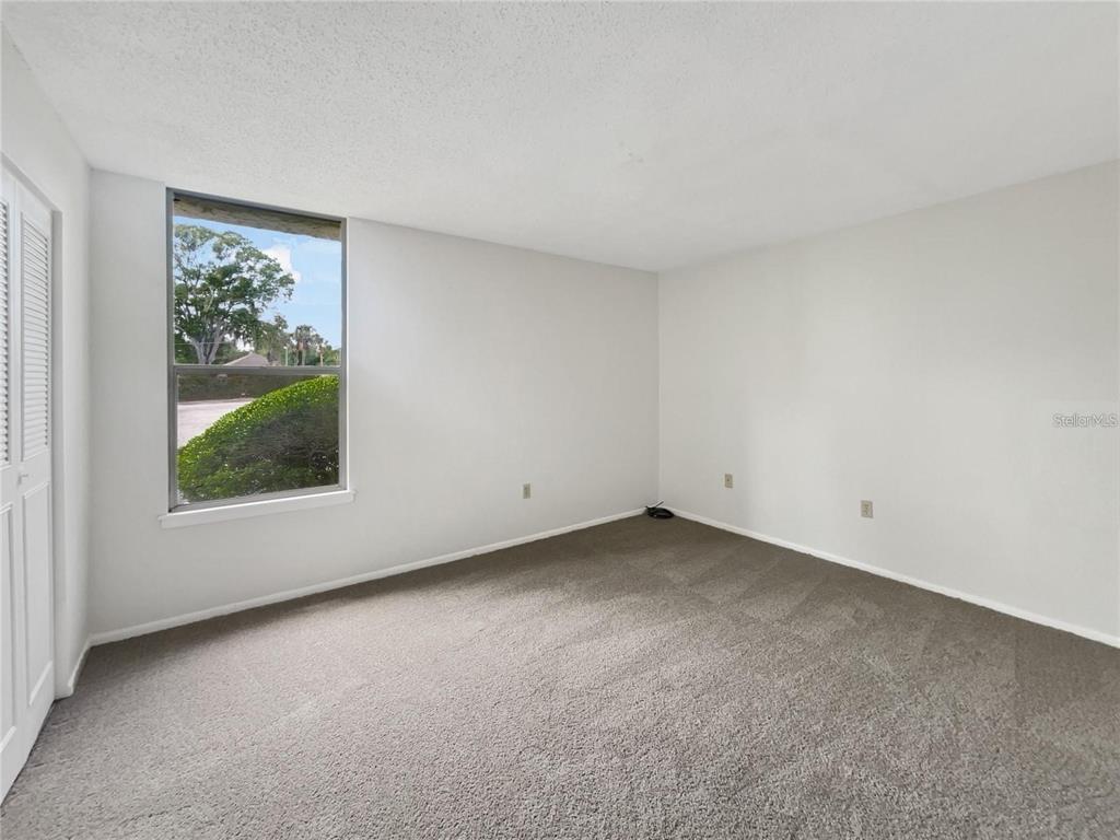 524 Orange Drive, Unit 22 Altamonte Springs, FL 32701 - Photo 10 of 18 an empty room with a window